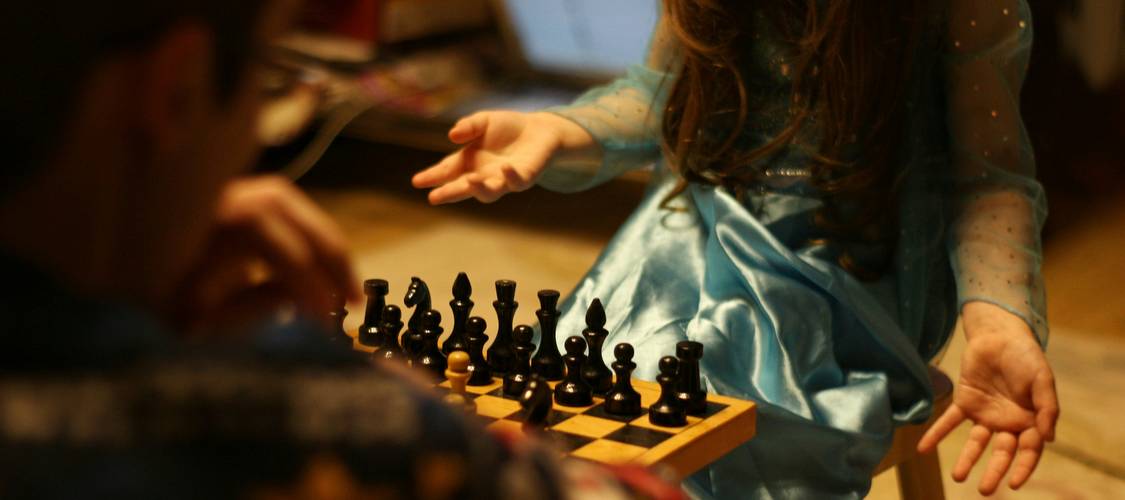 Family enjoying a cognitive challenge night together at home